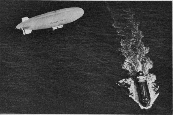 Airship over cargo ship