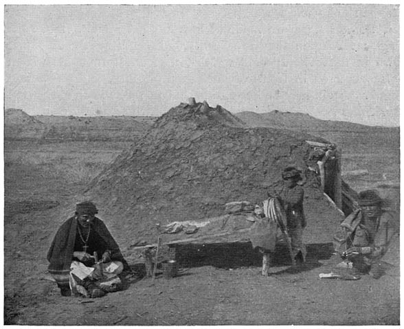 Fig. 10. Conical lodge with storm-door (from photograph by James Mooney).