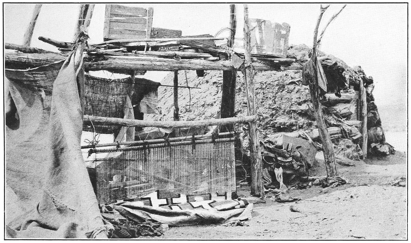 A NAVAJO HOGAN AND ITS BLANKET LOOM