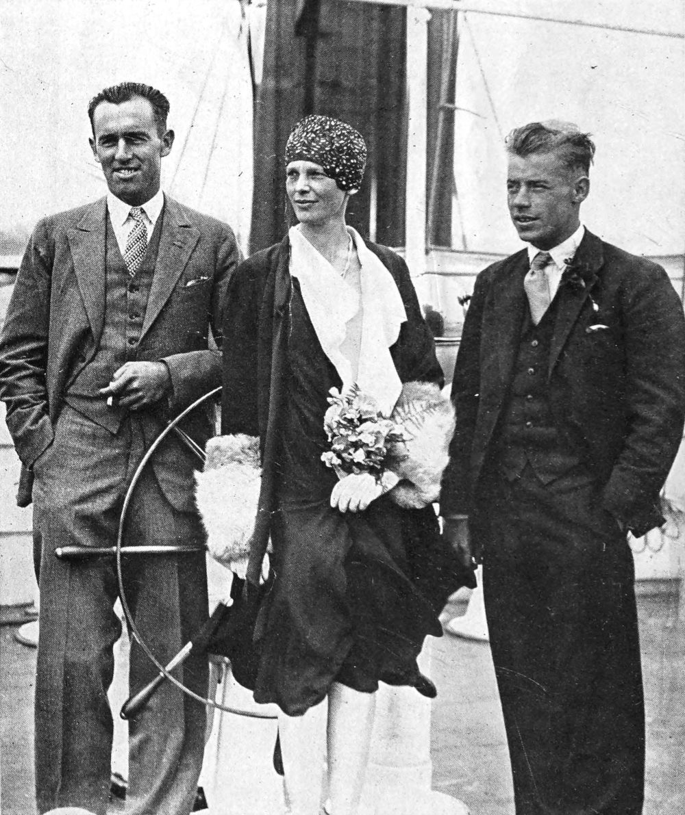 Photo full shot of Gordon, Earhart, and Stultz on a ship