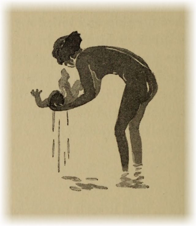 native woman bathing a baby