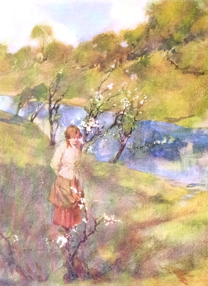 Young woman walking along the banks of the river Doon