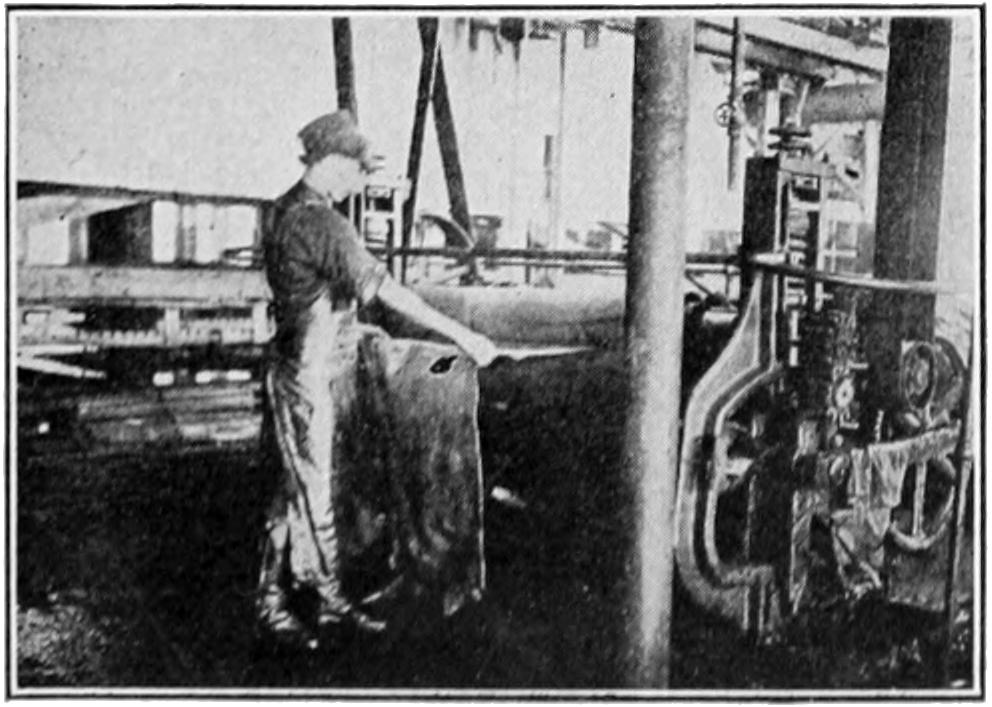 Man rolling a hide