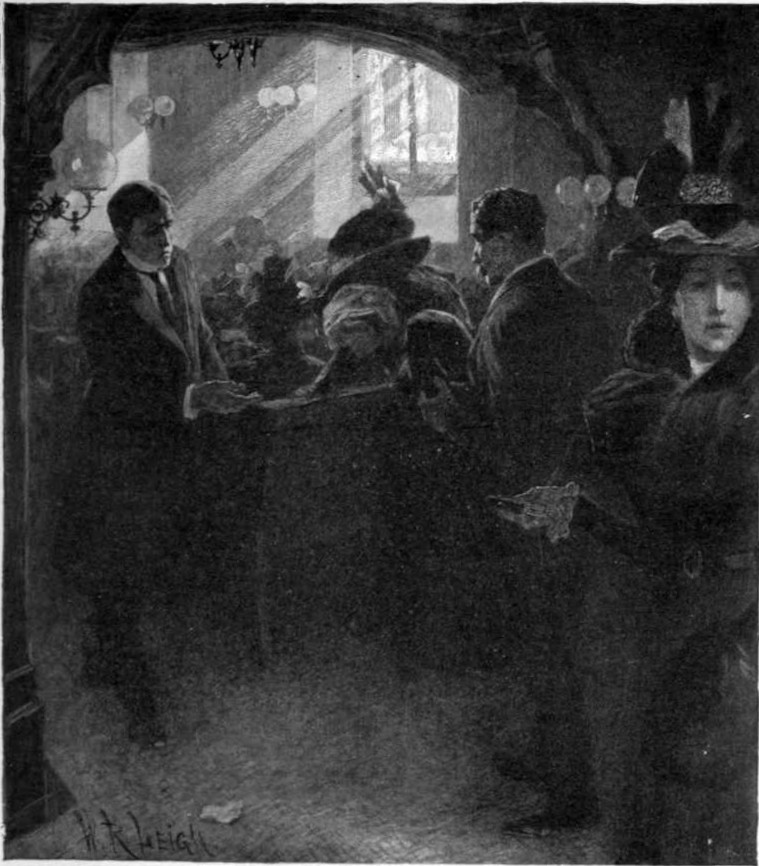 People gathered in a room lit by the sun streaming in from a window.
Some are seated in pews and some are standing.